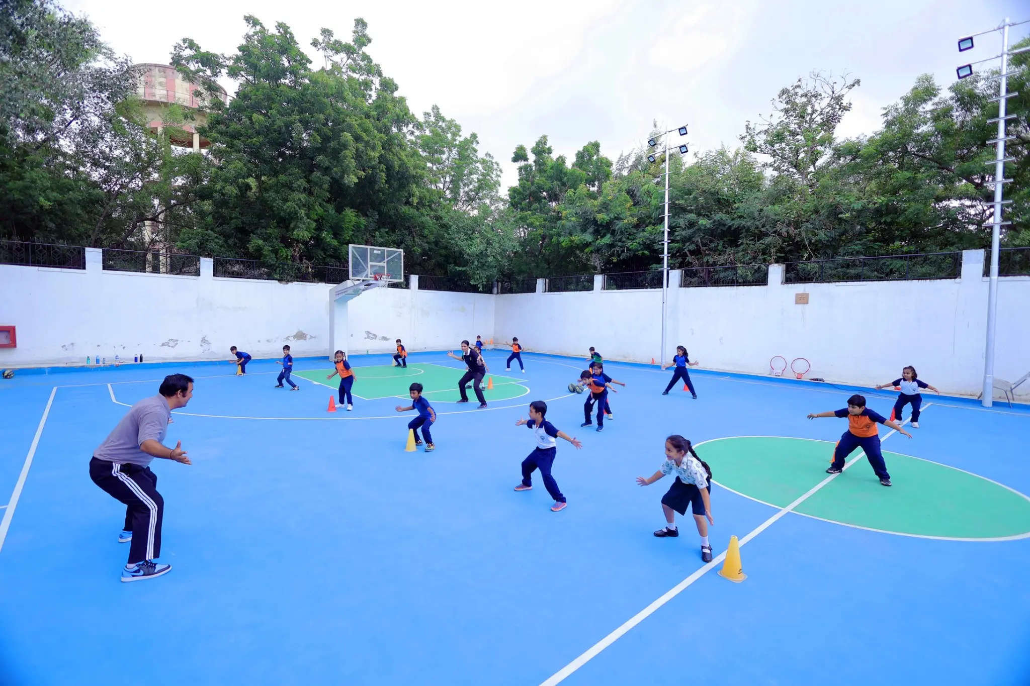 students having a great practise of Basketball