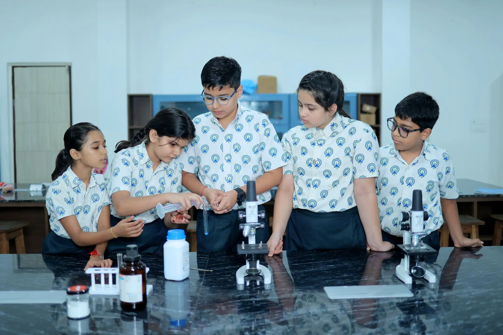 Children performing STEM activity
