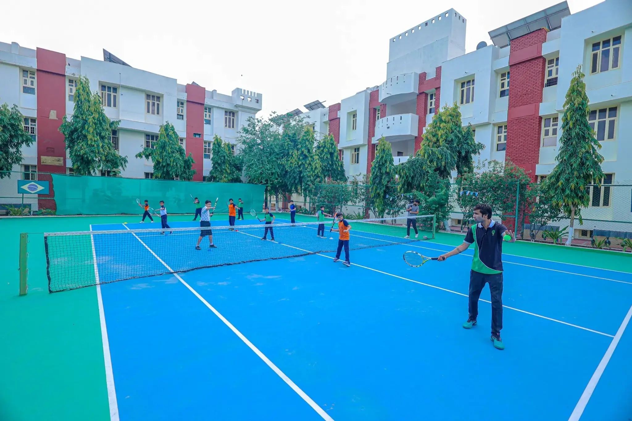students playing badminton in the badminton court