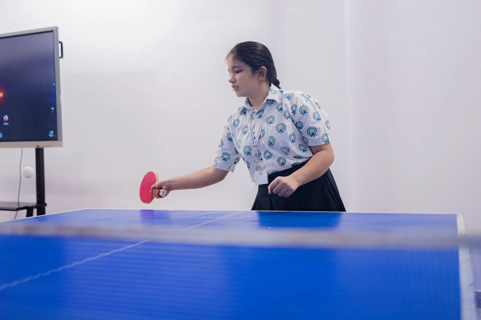 Student playing table tennis